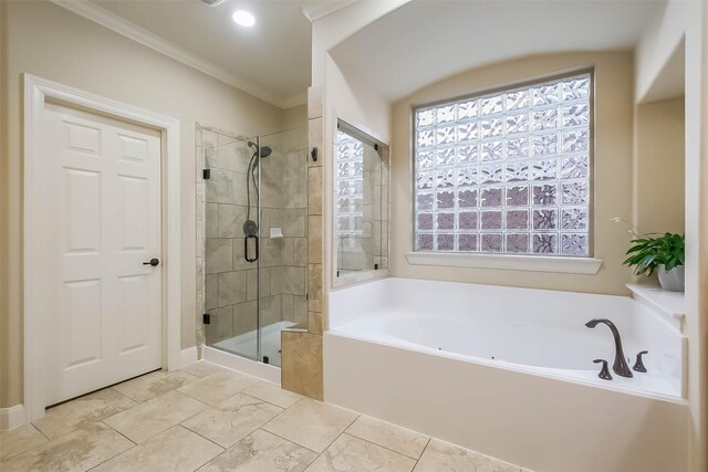 bathroom with a garden tub, a shower stall, and ornamental molding