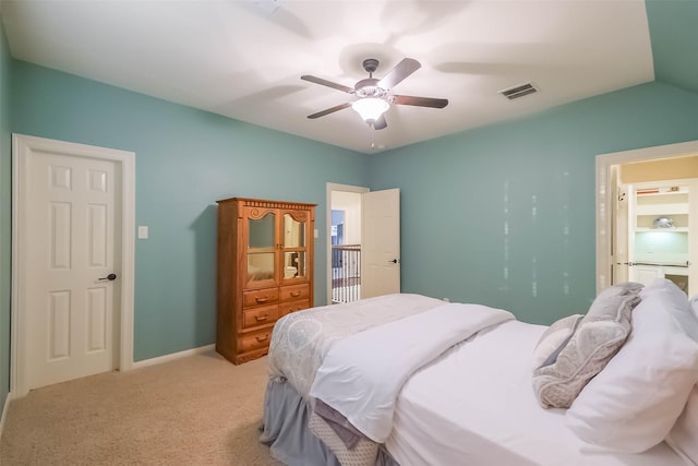 bedroom with light carpet, baseboards, visible vents, a ceiling fan, and lofted ceiling