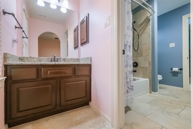 full bathroom with baseboards, visible vents, vanity, and toilet