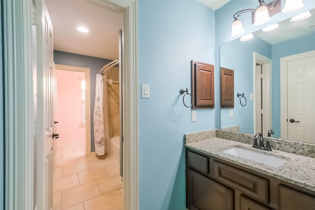 bathroom featuring shower / tub combo, tile patterned flooring, and vanity