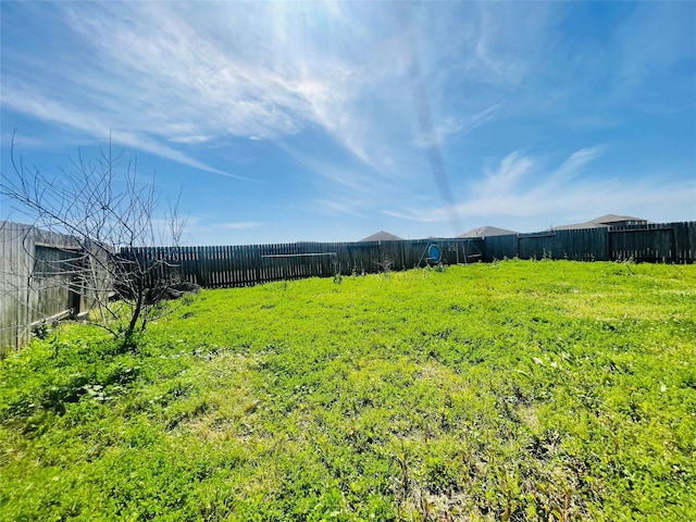 view of yard featuring fence