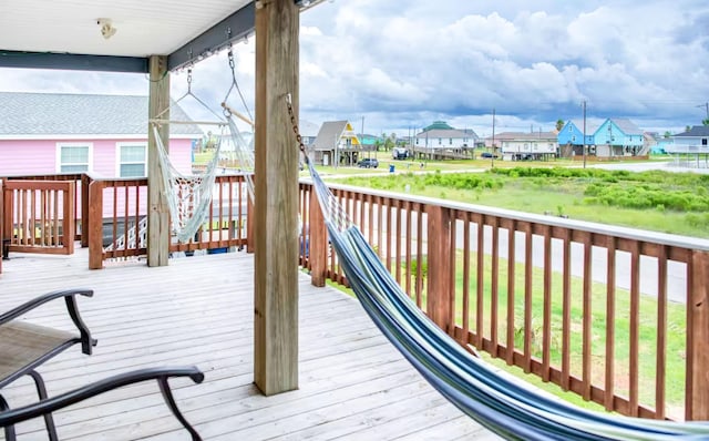 wooden terrace with a residential view