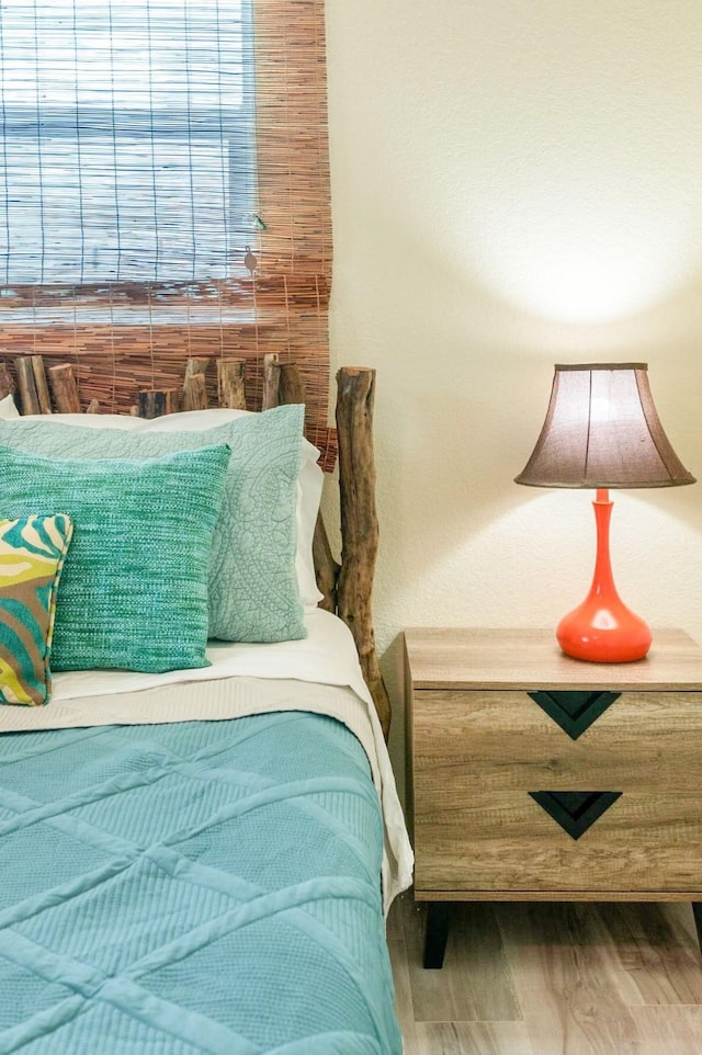 bedroom featuring wood finished floors