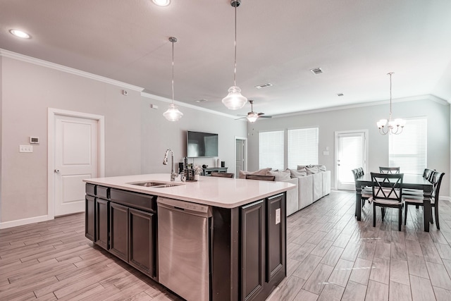 kitchen featuring a sink, light countertops, stainless steel dishwasher, wood tiled floor, and crown molding