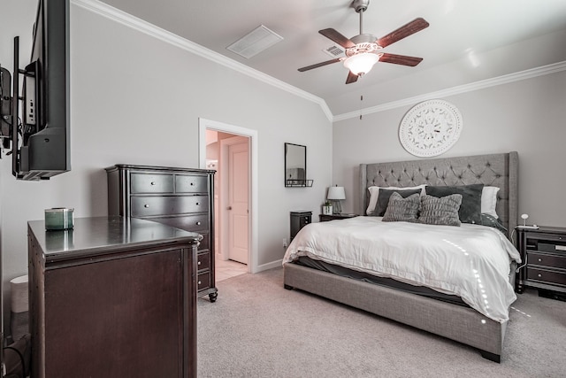 bedroom with baseboards, a ceiling fan, light colored carpet, ornamental molding, and vaulted ceiling