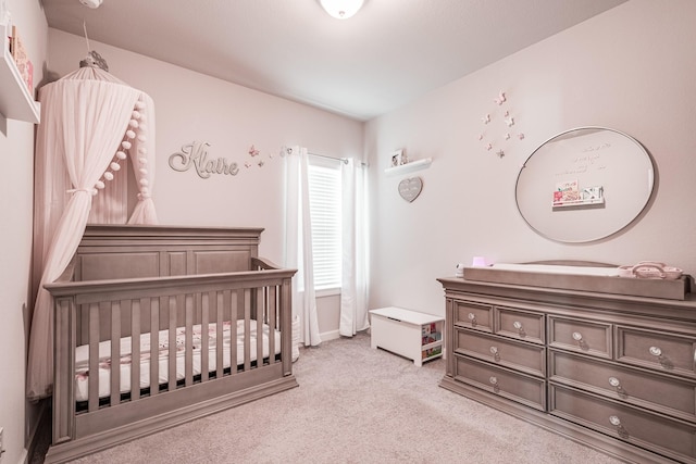 bedroom featuring carpet floors and a crib