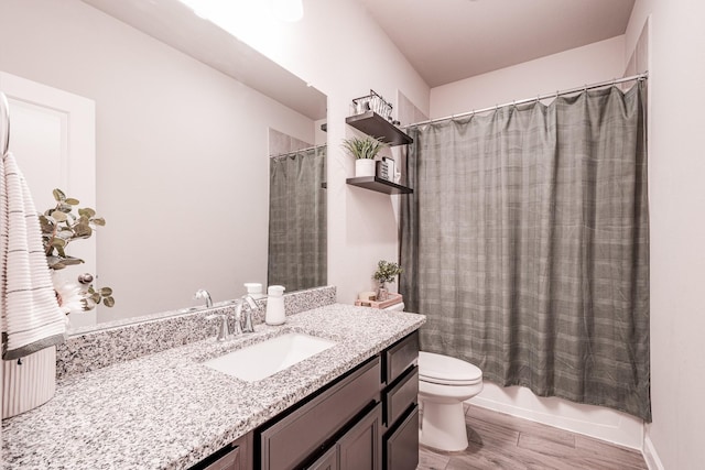 full bath with shower / bath combo with shower curtain, vanity, toilet, and wood finished floors