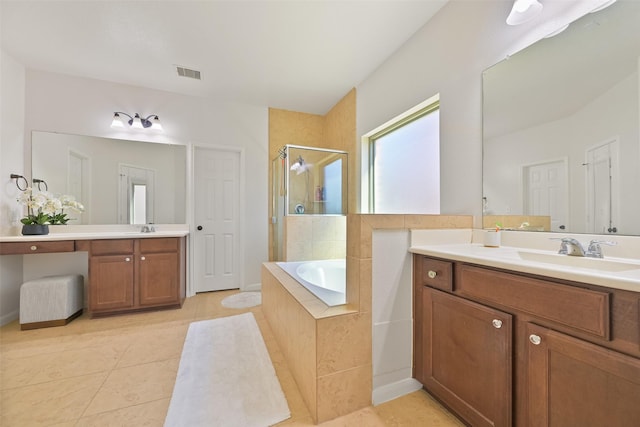 bathroom with a sink, visible vents, a stall shower, and a bath