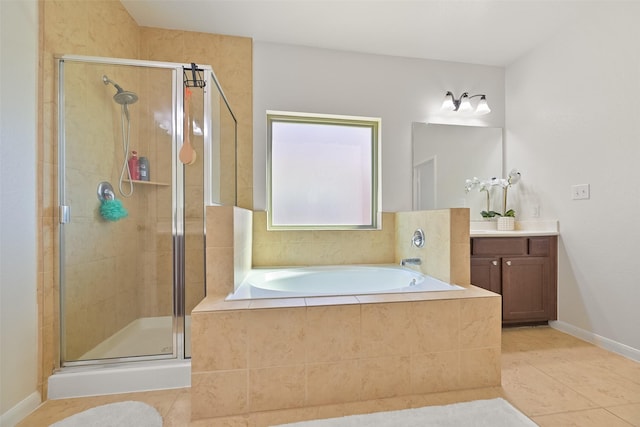 bathroom with vanity, baseboards, a stall shower, tile patterned flooring, and a garden tub