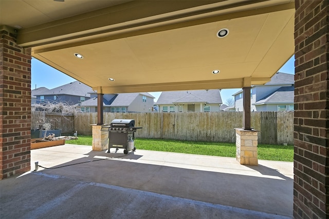 view of patio / terrace with grilling area and fence