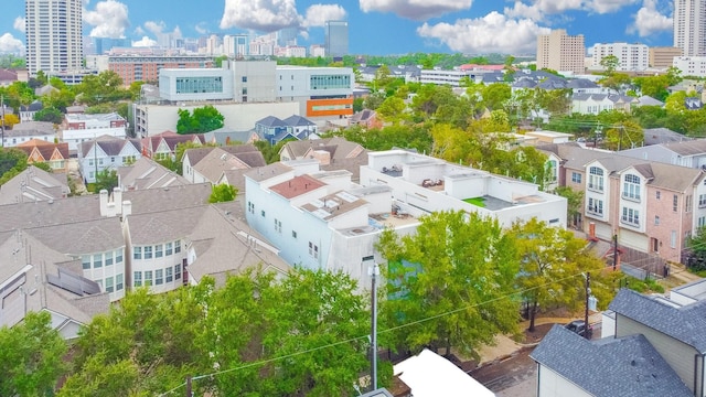 birds eye view of property featuring a city view