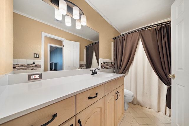 bathroom featuring visible vents, toilet, ornamental molding, vanity, and tile patterned flooring