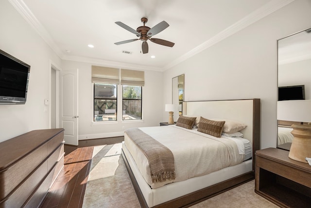 bedroom with ornamental molding, wood finished floors, visible vents, and recessed lighting