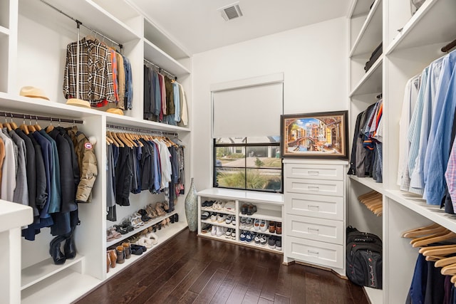 walk in closet featuring dark wood-type flooring and visible vents