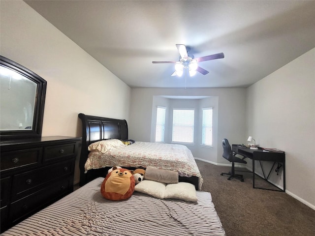 bedroom with ceiling fan, dark colored carpet, and baseboards