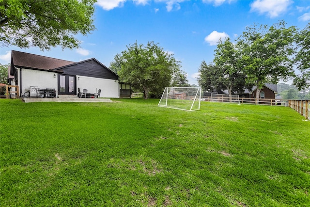 view of yard featuring a patio area and fence