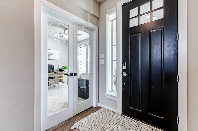 entrance foyer featuring dark wood-type flooring and french doors