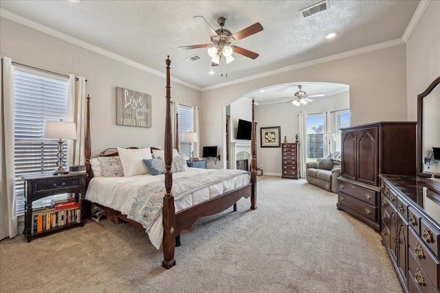 bedroom featuring arched walkways, access to outside, visible vents, and light carpet