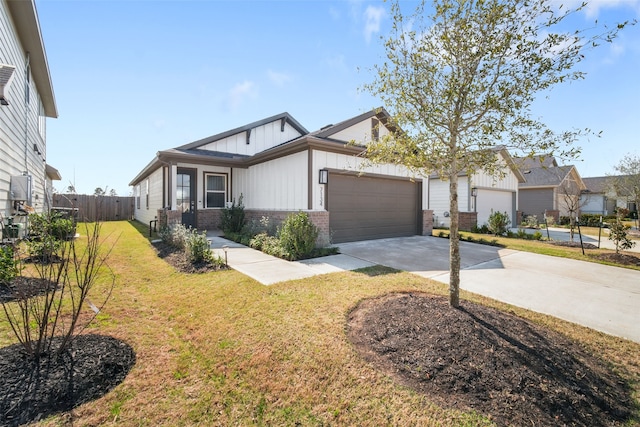 view of front of house featuring a garage, concrete driveway, fence, board and batten siding, and a front yard