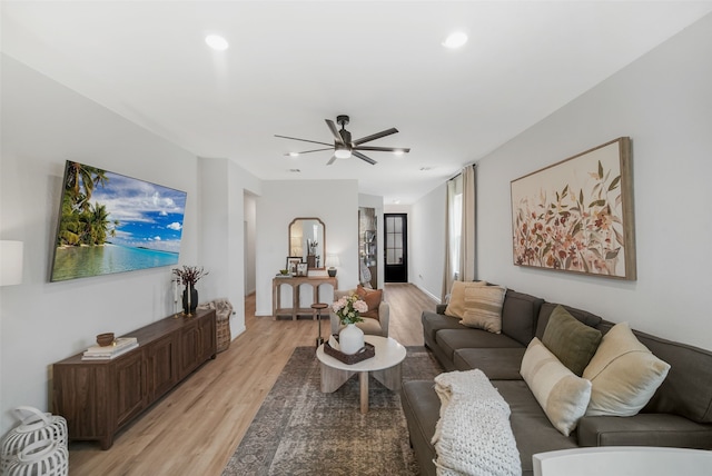 living area with ceiling fan, light wood finished floors, and recessed lighting