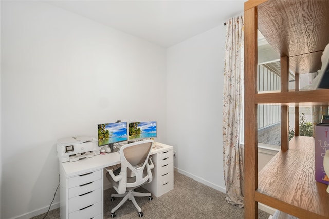 home office featuring carpet floors and baseboards