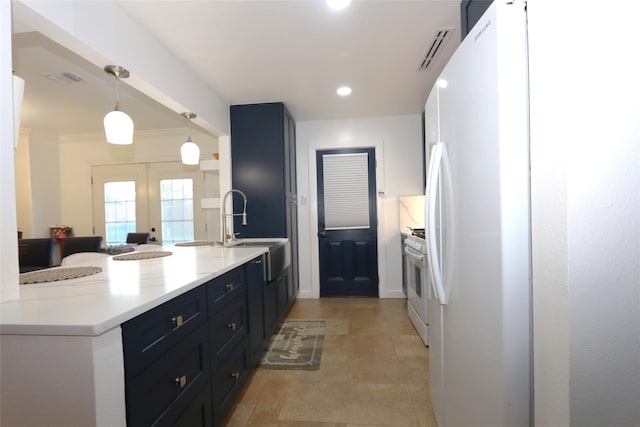 kitchen featuring white appliances, visible vents, a peninsula, french doors, and a sink