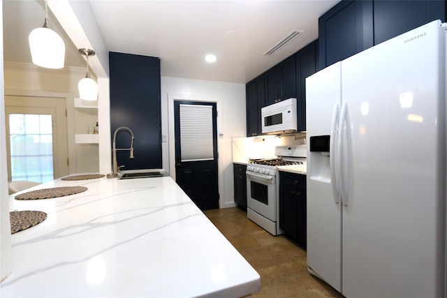 kitchen featuring white appliances, visible vents, light stone counters, and a sink