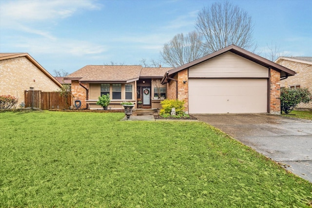 ranch-style home with driveway, a garage, a front lawn, and brick siding