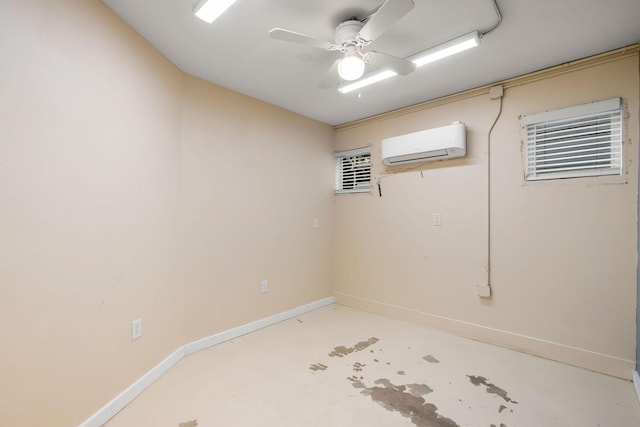 basement featuring ceiling fan, a wall mounted AC, and baseboards