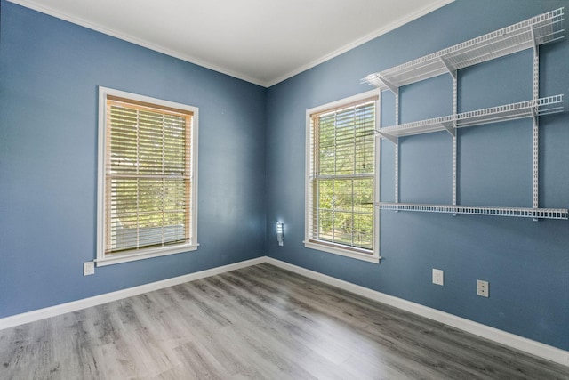 163 N Fairway Loop, Coldspring, TX 77331 - empty room featuring crown molding, wood finished floors, and baseboards