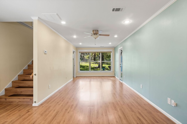 unfurnished living room with visible vents, baseboards, wood finished floors, stairs, and recessed lighting