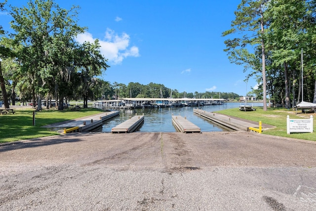 163 N Fairway Loop, Coldspring, TX 77331 - dock with a boat ramp, a water view, and a lawn