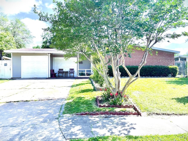 ranch-style house with fence and a front yard