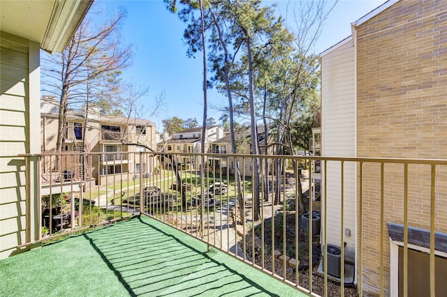 balcony with a residential view and central air condition unit