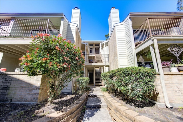 view of property featuring stairs