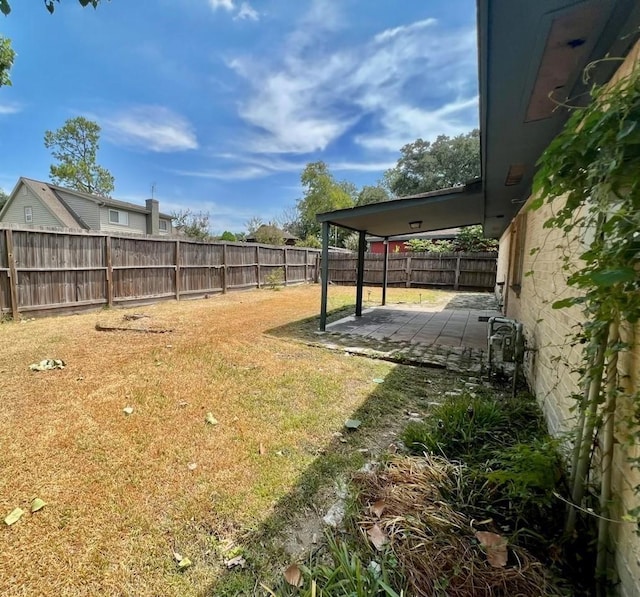 view of yard featuring a fenced backyard and a patio