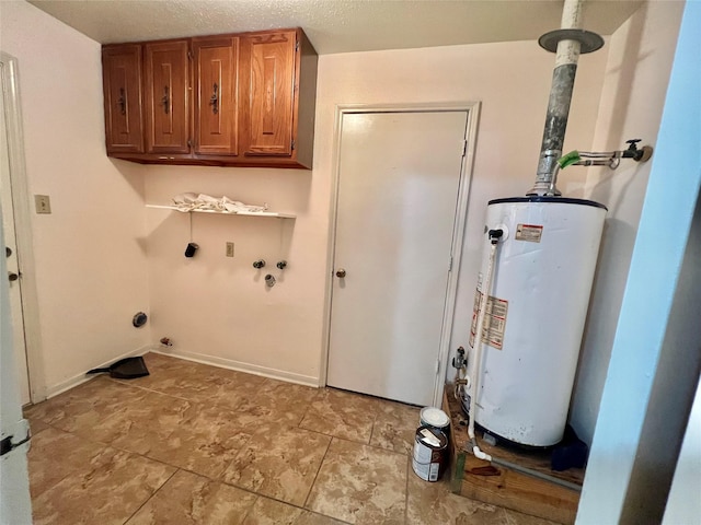 laundry room featuring hookup for an electric dryer, washer hookup, baseboards, water heater, and cabinet space