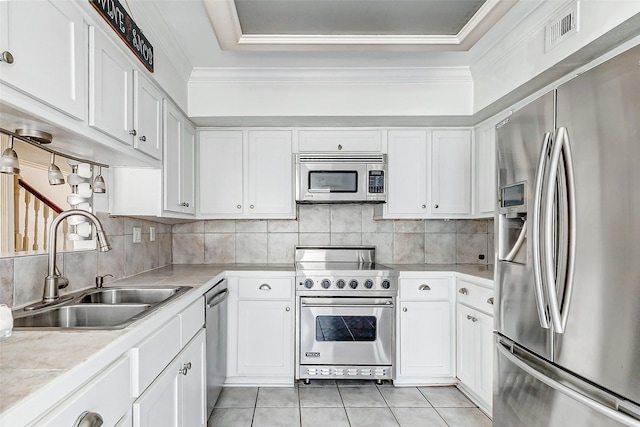 kitchen with light tile patterned floors, visible vents, appliances with stainless steel finishes, ornamental molding, and backsplash