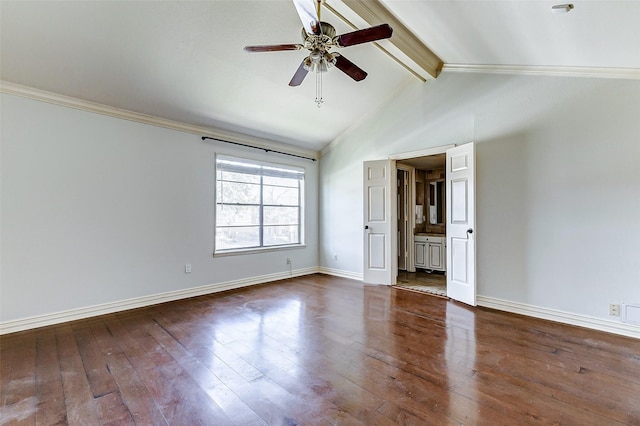 spare room featuring lofted ceiling with beams, a ceiling fan, baseboards, dark wood-style floors, and crown molding