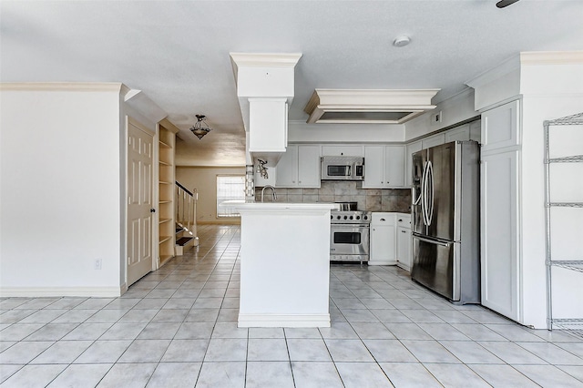 kitchen with light tile patterned floors, stainless steel appliances, white cabinets, decorative backsplash, and crown molding