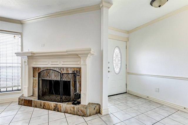 entrance foyer featuring baseboards, light tile patterned flooring, a fireplace, and crown molding