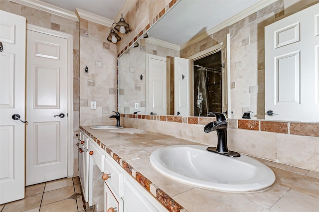 bathroom featuring ornamental molding, a sink, tile walls, and double vanity