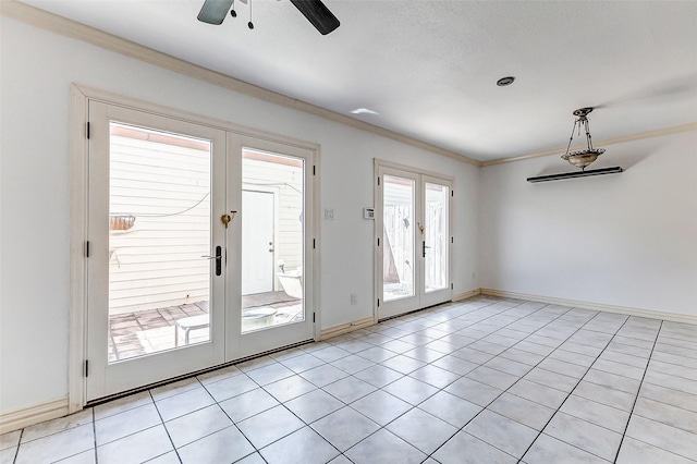 doorway with ornamental molding, french doors, baseboards, and light tile patterned floors