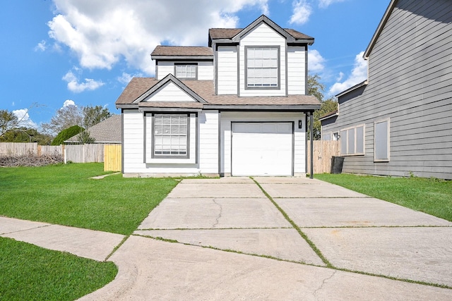 traditional home with fence, a front lawn, concrete driveway, and roof with shingles