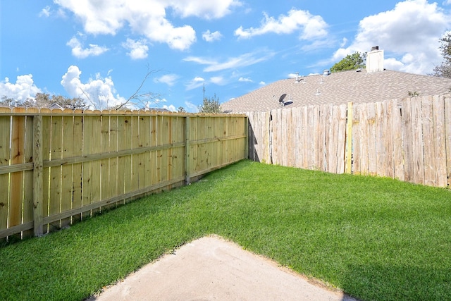 view of yard featuring a fenced backyard