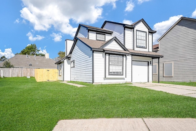 view of front of property featuring a garage, concrete driveway, a front lawn, and fence