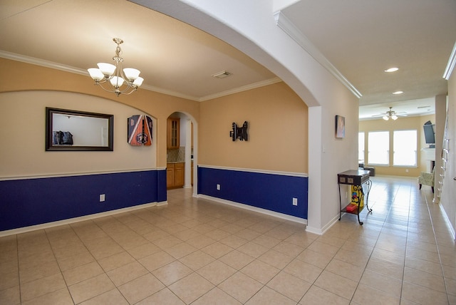 empty room featuring ornamental molding, arched walkways, visible vents, and light tile patterned floors