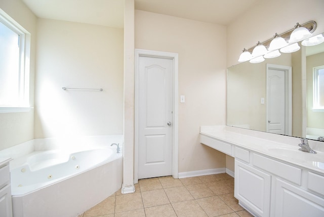 bathroom with a whirlpool tub, a wealth of natural light, and tile patterned floors