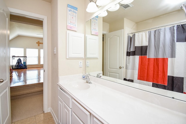 bathroom featuring visible vents, a shower with shower curtain, tile patterned flooring, and vanity