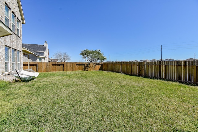 view of yard featuring a fenced backyard